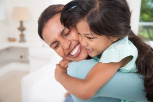 mom hugging child Taos Community Foundation https://www.taoscf.org/wp-content/uploads/2023/06/TCF-Website-Logo.png