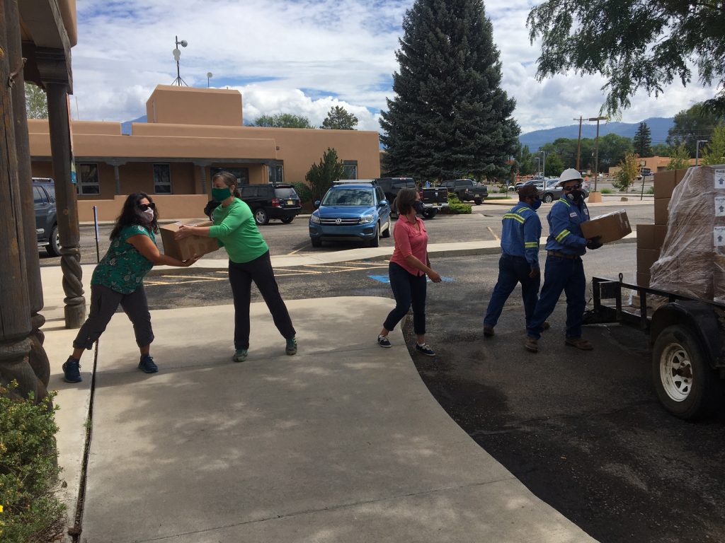 Packing Hand Sanitizer at Taos Community Foundation